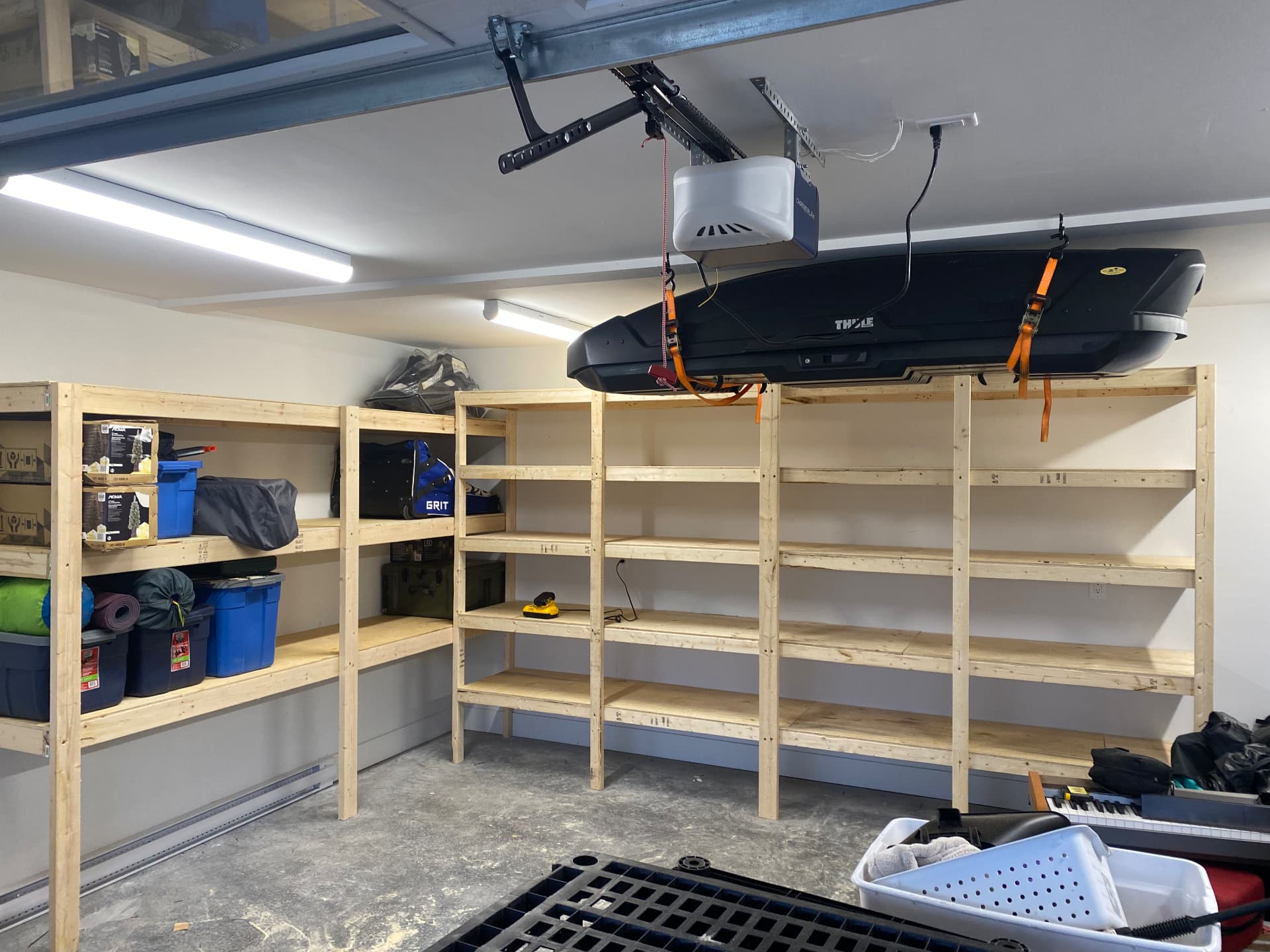 Custom wood garage shelving built along a garage wall